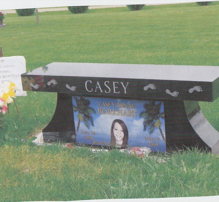 Finished Van Zee Bahama Blue memorial bench with a laser-etched portrait